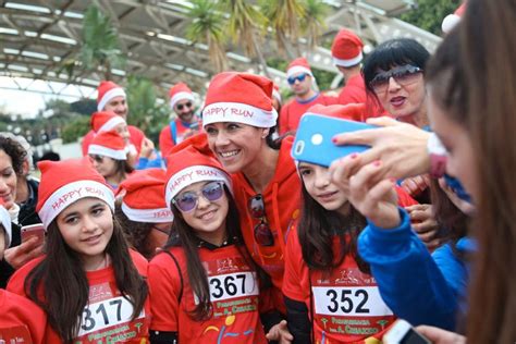 Moak at the “Happy Run for Christmas” with Giusy Versace.